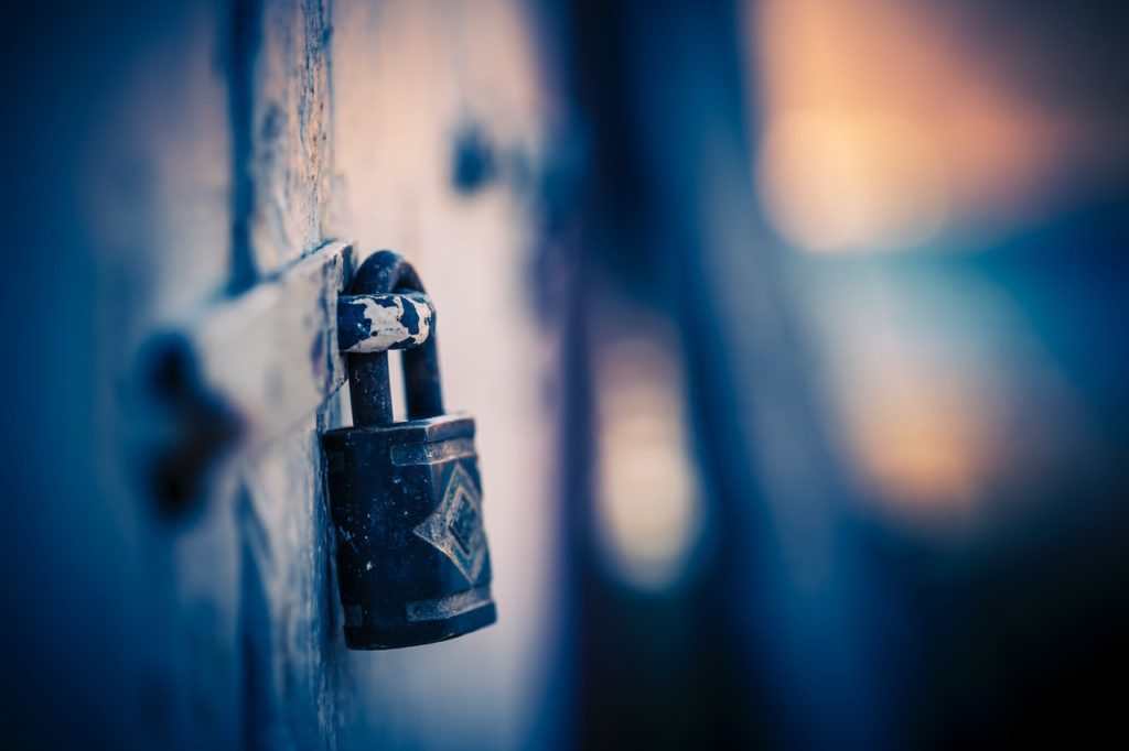 A padlock on a wall representing the sanctity of solicitor-client privilege over communications between a lawyer and their client